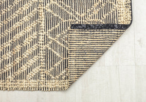 Close-up of geometric diamond pattern rug, showcasing its detailed and durable weave.