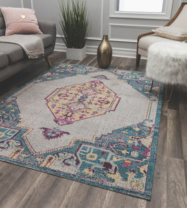 Colorful vintage area rug with intricate patterns and a blue border, adding charm and character to any living room.