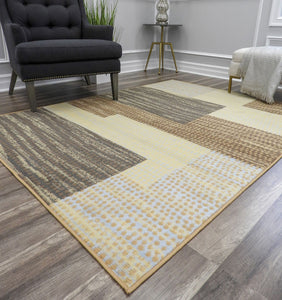 Stylish living room with a beige, yellow, and gray block patterned rug, black armchair, and modern decor elements for a contemporary look