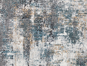 Abstract rug with distressed blue, white, and beige patterns, perfect for adding a modern artistic touch to any living space.