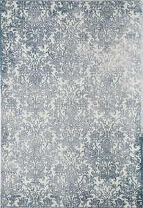 Detailed view of a blue and white floral area rug showcasing its intricate design.