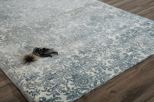 Blue and white floral area rug with intricate patterns, adding a touch of elegance to any room.