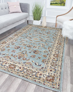 Elegant area rug with light blue background and intricate floral patterns, perfect for adding a classic touch to any living room.