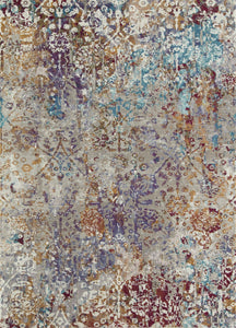 Top view of an abstract area rug with a mix of blue, gold, and white colors.