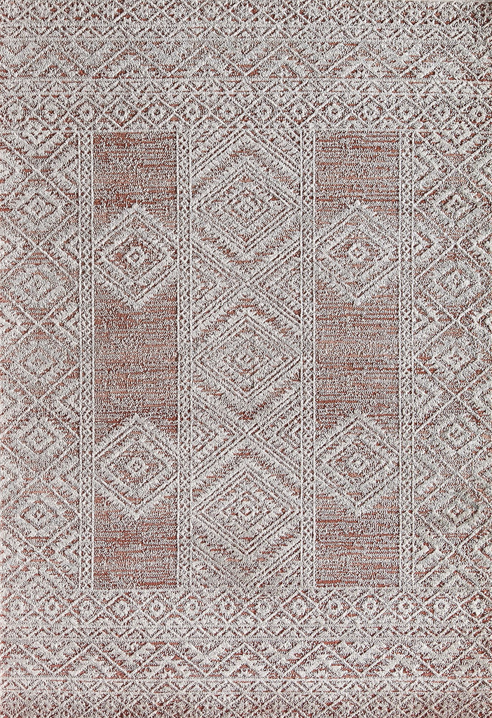 Overhead view of a red and white geometric pattern rug with intricate designs.