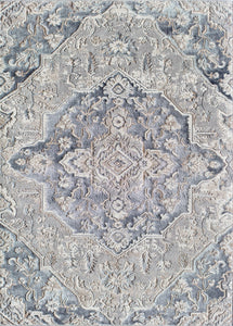 Detailed overhead view of a gray and white traditional pattern rug.