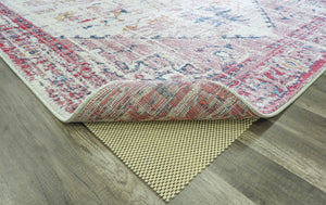 Antique rose area rug with intricate patterns, showcasing the rug's underside and texture.