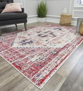 Antique rose area rug with intricate patterns in a modern living room.