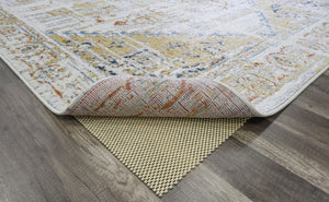 Close-up view of the underside and texture of a burnt sienna area rug.