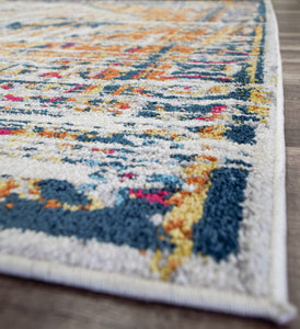 Side view of burnt sienna area rug with intricate patterns and vibrant colors.