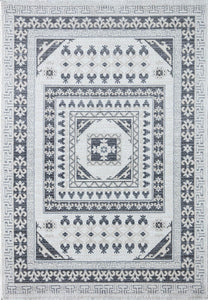 Top view of a white and grey patterned area rug with intricate geometric designs.