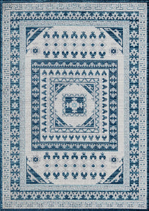 Top view of a blue and white geometric patterned rug featuring intricate floral and border designs.