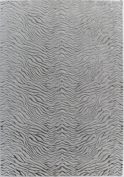 Top view of a white textured rug with a wave-like pattern.