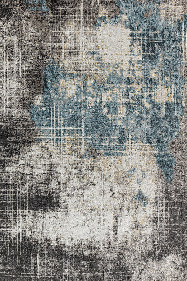 Abstract rug with a distressed blue and beige design, perfect for adding a modern and artistic flair to any living space.