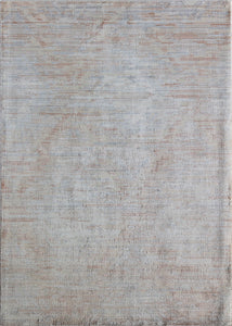 Minimalist beige area rug with subtle texture, perfect for adding a touch of elegance and simplicity to any room.