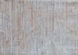 Close-up of a beige area rug with a subtle abstract pattern, showcasing its intricate design and soft texture for modern decor.