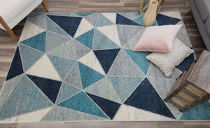 Blue and white geometric patterned rug in a modern living room.