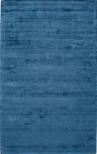 Blue area rug with a modern, minimalistic design, perfect for adding a touch of elegance to any room.