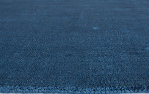 Close-up of blue area rug highlighting its fine texture and durable quality.