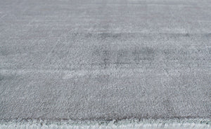 Close-up of light gray area rug highlighting its soft texture and high-quality weave.