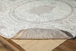 Boho grey area rug with circular abstract patterns, showcasing the rug's underside and texture.