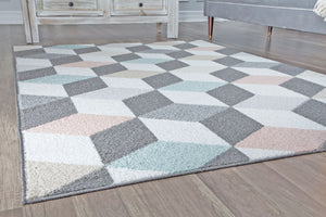 Geometric rug with 3D cube patterns in grey, pink, and blue, placed in a modern living room. Enhances contemporary decor with style.