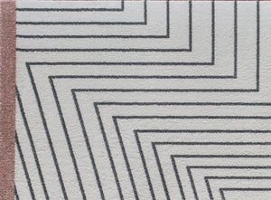 Detailed view of a modern rug with black geometric lines on a white background and a brown border, ideal for contemporary home decor