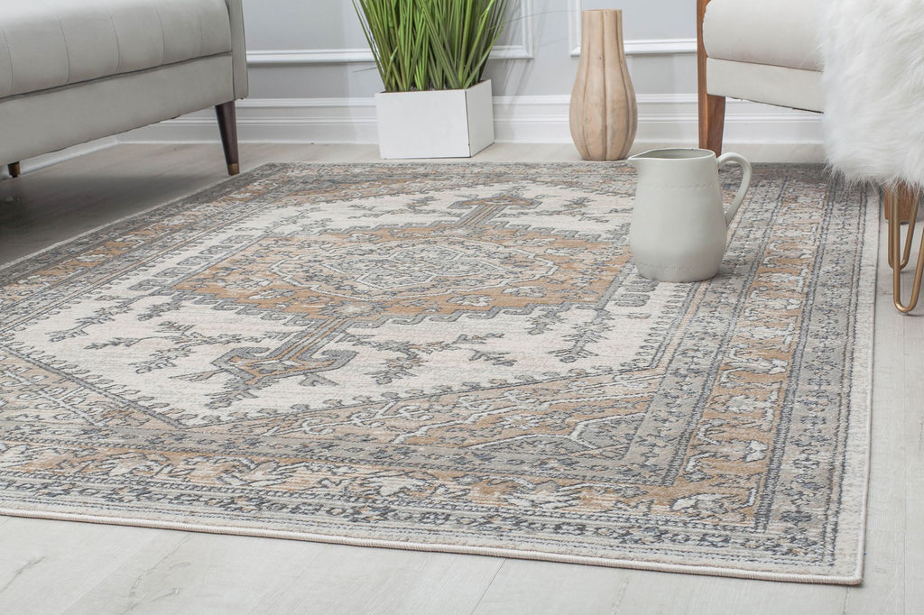 Abstract beige and gray rug in a contemporary living room setting.