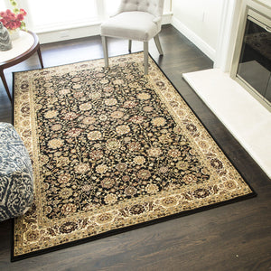 Luxurious black rug with intricate patterns in an elegant room featuring striped armchairs, a small table with flowers, and a fireplace