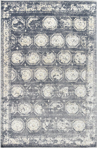 Full view of an abstract rug with a geometric pattern in gray and white tones.