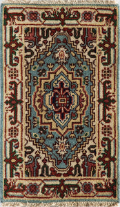 Top view of a vibrant traditional area rug with blue and red patterns.