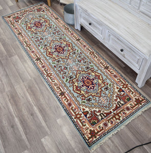 Blue and red traditional runner rug placed in a rustic room.