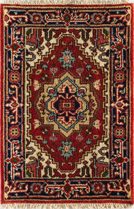 Detailed view of a large red and blue area rug with intricate, traditional designs.