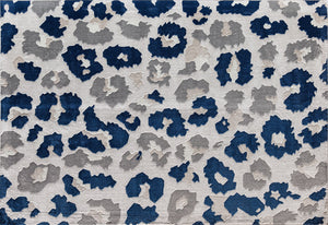 Top view of a blue and gray floral patterned rug with abstract flower designs.