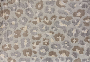 Top view of a beige and gray floral patterned rug with abstract flower designs.