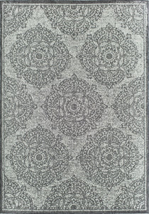 Full view of a grey area rug with intricate floral patterns.