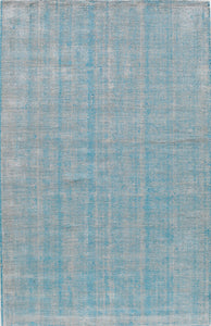 Minimalist blue and white woven area rug, perfect for adding a subtle and stylish touch to any room.