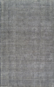 Minimalist gray woven area rug, perfect for adding a subtle and stylish touch to any room.