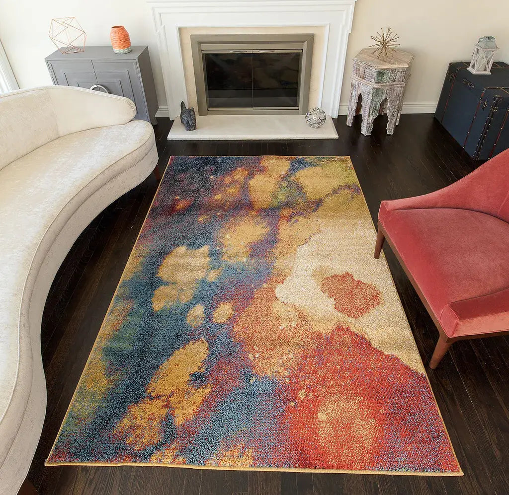 Abstract multicolored Devon rug with vibrant hues of yellow, blue, and red, placed in a modern living room setting.