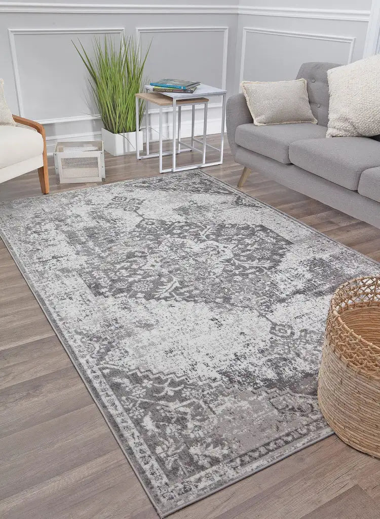 Neutral-toned Freya rug with subtle, intricate designs, styled in a light and airy living room with modern furniture.