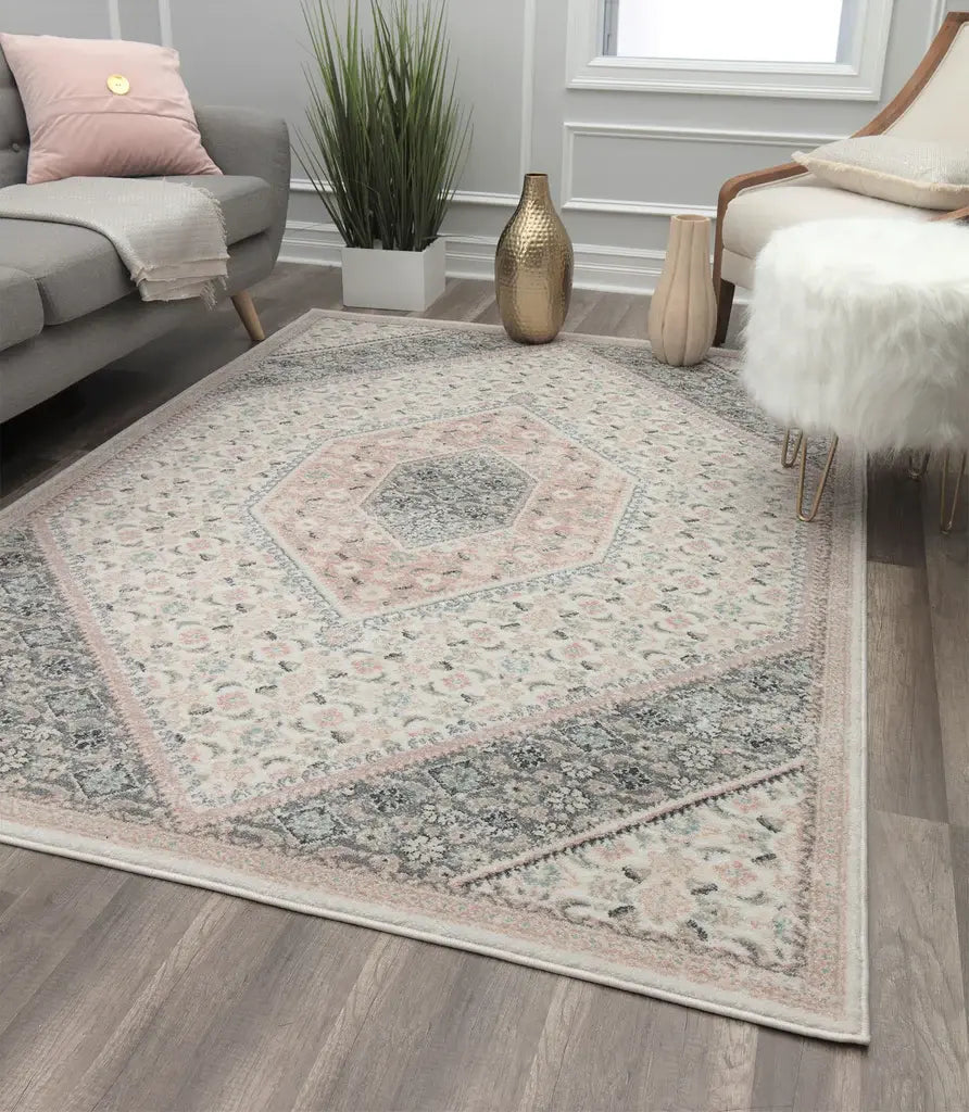 Elegant beige and grey rug with intricate designs, featured in a sophisticated living area with modern accents.