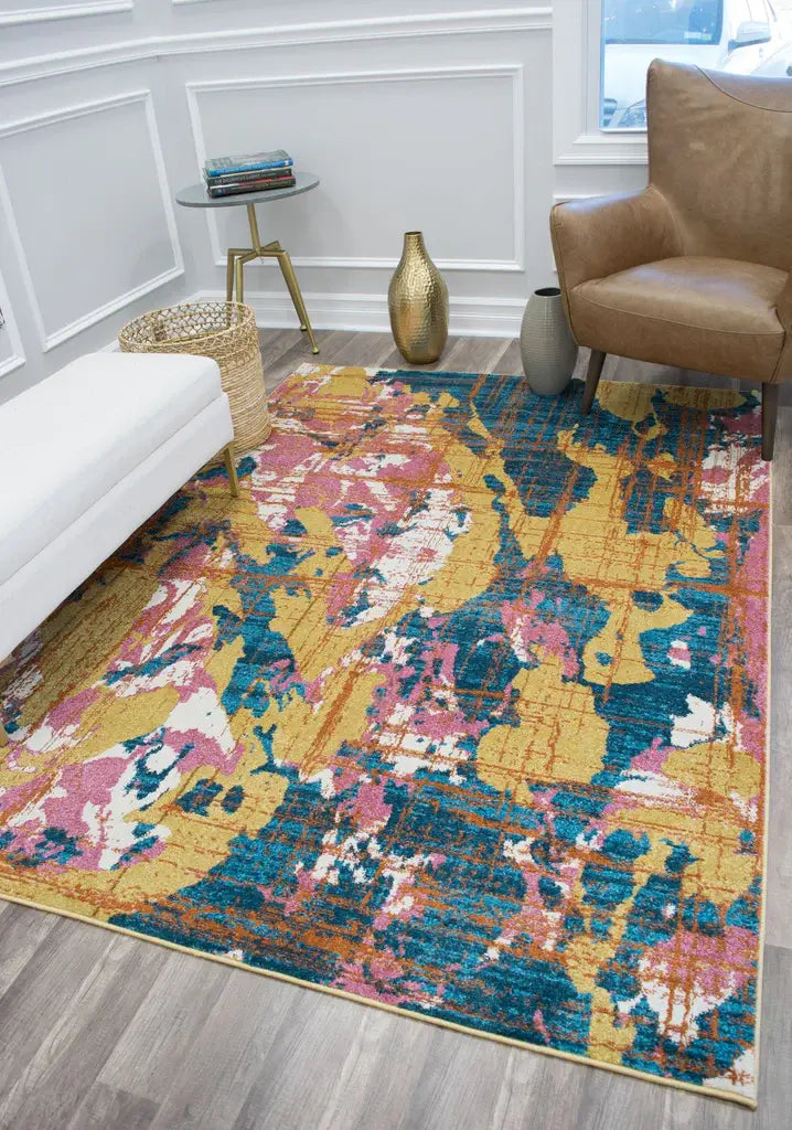 Modern living room with a colorful abstract area rug featuring bold hues of yellow, blue, and pink, enhancing the brown leather chair and decor.