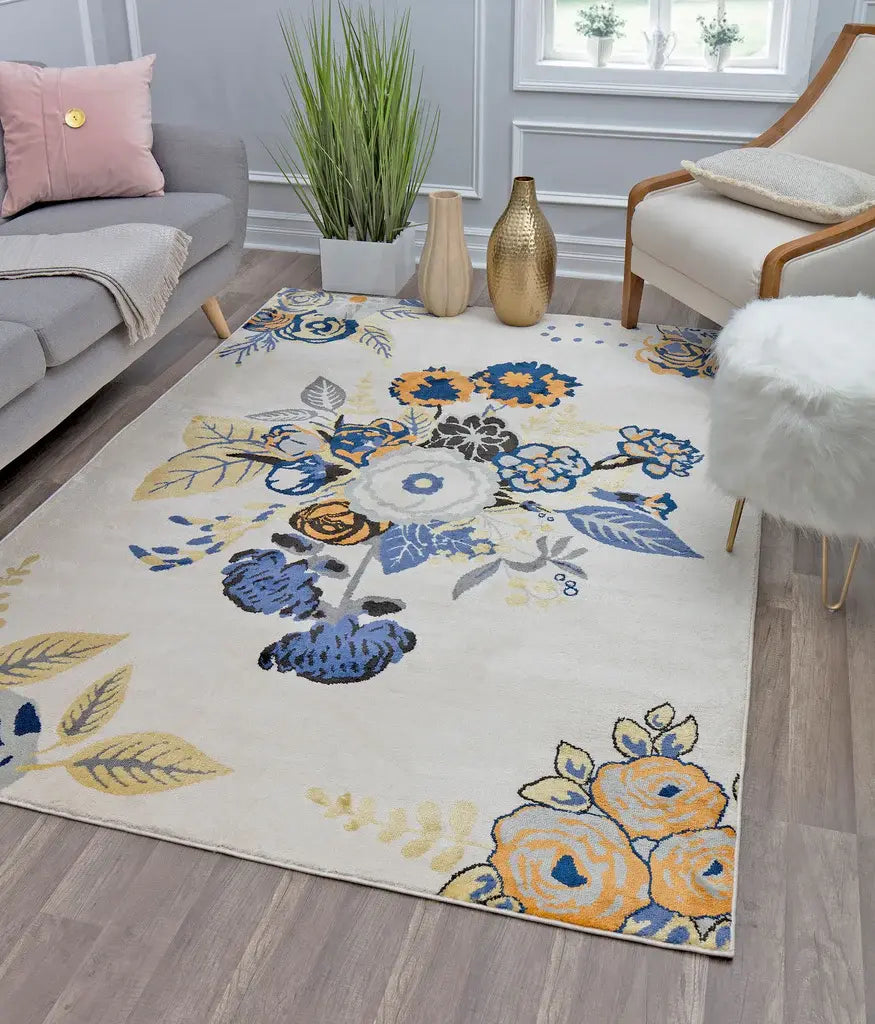 Floral-patterned rug in a cozy living room, featuring a sofa with pink pillows, a potted plant, and decorative vases on the floor